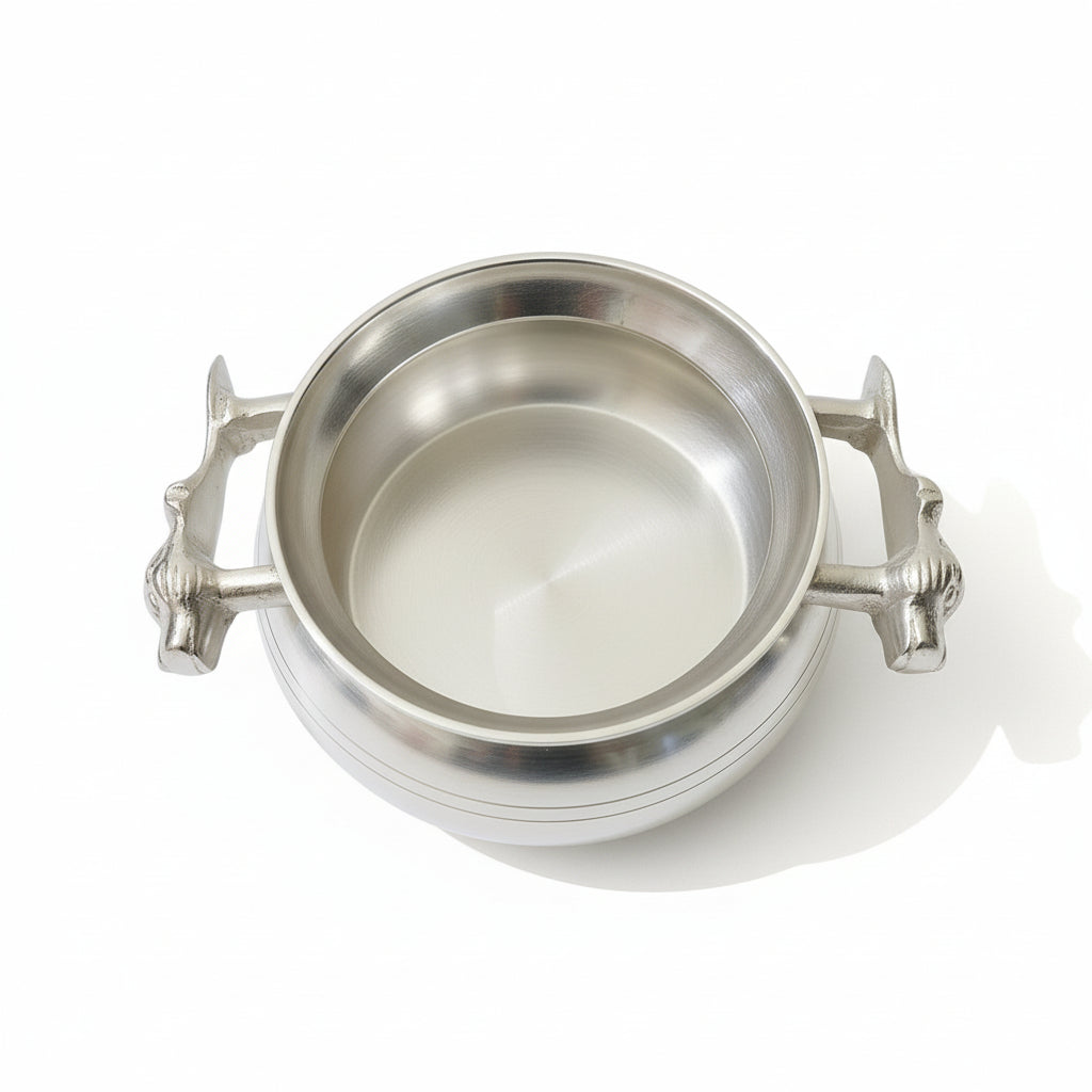 Top view of deep silver plated brass serving handi with dual tiger head handles